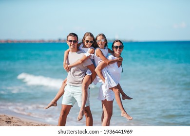 Family of four on the beach vacation