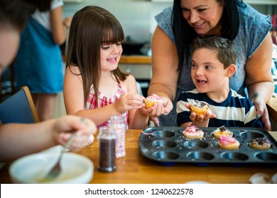 Family with fresh homemade cucakes