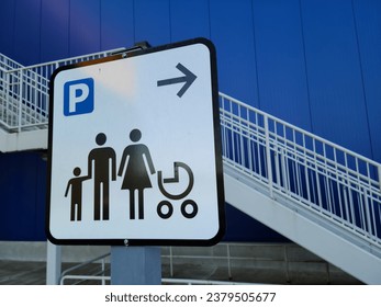 Family friendly, priority parking sign in a commercial building