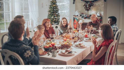 Family and Friends Gather at Home for a Traditional Christmas Dinner with a Turkey Roast. Living Room is Crowded with Senior and Young Adults Enjoying Holiday Dishes - Powered by Shutterstock