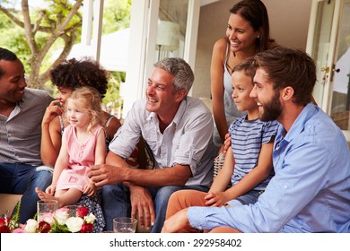 Family And Friends Gathered In A Conservatory