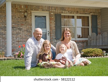 Family in Front of Their Home