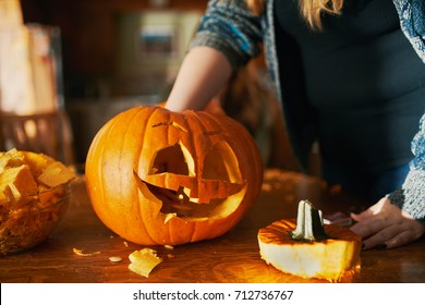 family fun activity - carved pumpkins into jack-o-lanterns for halloween close up - Shutterstock ID 712736767