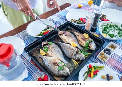 Family Gathering To Eat Fish Together