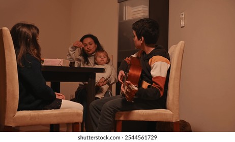 A family gathers in a warm, cozy room, enjoying quality time together. A boy plays the acoustic guitar, creating a soothing ambiance while others listen attentively. Cinematic light adds depth. - Powered by Shutterstock