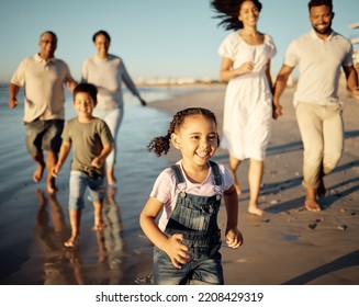 Family, Girl And Beach With Children, Parents And Grandparents Walking Together On Holiday By The Sea. Happy Generations Of Black Family Walk By The Ocean In The Sunset At Reunion, Vacation Or Travel