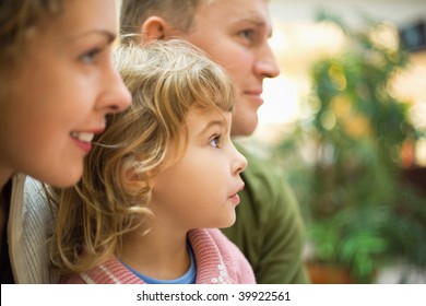 Family With Girl Looking Forward