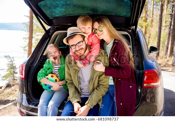 Family going on a car\
trip