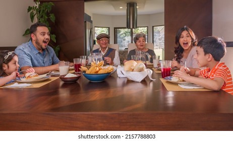 Family With Grandparents Enjoying Thanksgiving Meal At Table. Holidays Or Birthdays.