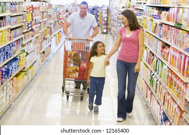 Family Grocery Shopping In Supermarket