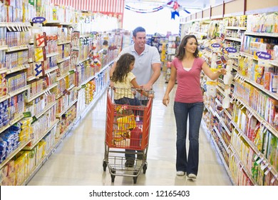 Family Grocery Shopping In Supermarket