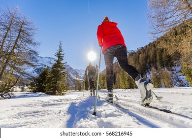 A family group of cross country skiers on a sunny winter morning in Italy Alps, South Tirol, Solda.
