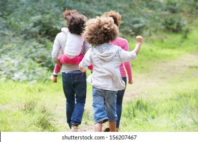 Family Group Walking In Countryside