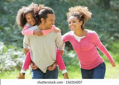 Family Group Walking In Countryside