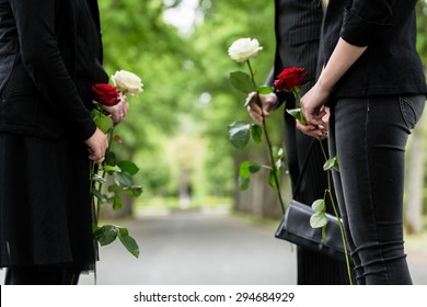 Family In Guard Of Honor At Funeral, Only Torso Of People To Be Seen