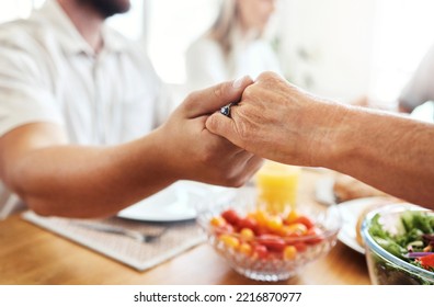 Family, Hands And Thanksgiving Lunch Prayer In House, Home And Restaurant With Men, Women And Food. Zoom, Worship Praying Community With Hand, Parents Or Seniors For Festive Food At Dinner Table