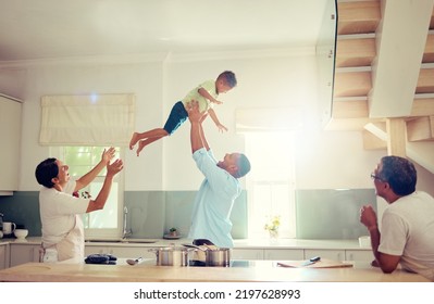 Family Happy, Home And Father Love Of A Man With His Child In The Air Playing In A House Kitchen. Generation Of Men Smile At Home With A Fun Time Together And Relax And Comic Mindset With Sun Shining