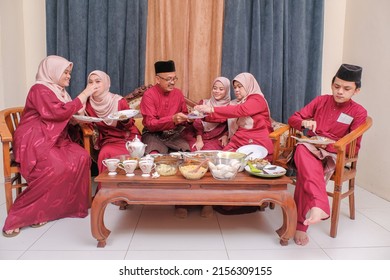 A Family Hari Raya Aidilfitri Eid-Ul-Fitr Meal and Celebration in Malaysia .Family, Happiness and Forgiveness Concept.