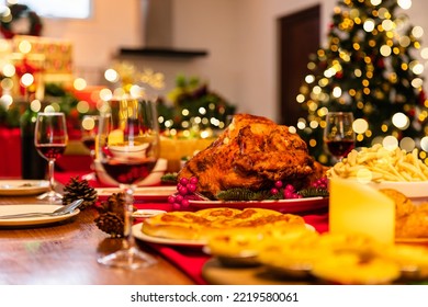 Family have a celebration dinner in party with wine, champagne on Merry Christmas Eve Xmas on holiday at home. Roasted Thanksgiving Turkey with Side Dishes.Thanksgiving Celebration .