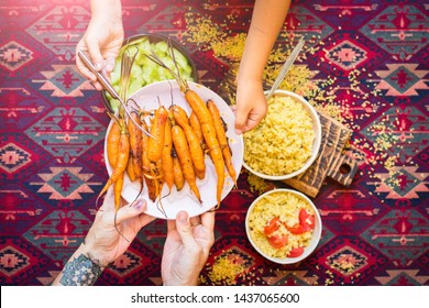 Family Have, Eat Meal Together. Adult And Child, Kid Hands. Rich Vegetarian, Vegan Lunch Or Dinner With Baked Carrots, Vegetables Salad And Cooked Bulgur Grain In Bowls. 