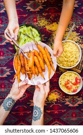 Family Have, Eat Meal Together. Adult And Child, Kid Hands. Rich Vegetarian, Vegan Lunch Or Dinner With Baked Carrots, Vegetables Salad And Cooked Bulgur Grain In Bowls. 