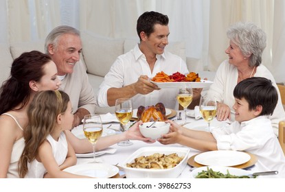 Family Having A Big Dinner Together At Home