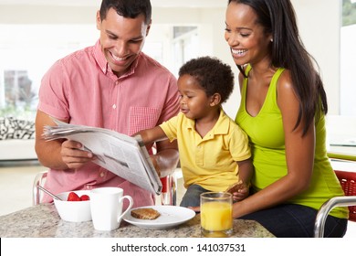 Family Having Breakfast In Kitchen Together - Powered by Shutterstock