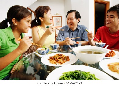 Family Having Dinner At Home