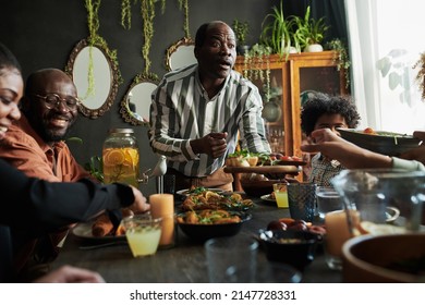 Family Having Dinner At Table