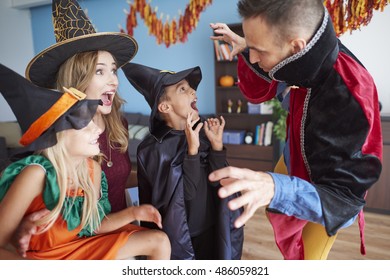 Family Having Fun At Halloween Party