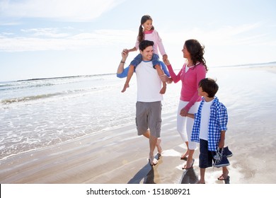 Family Having Fun On Beach Holiday