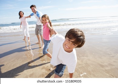 Family Having Fun On Beach Holiday