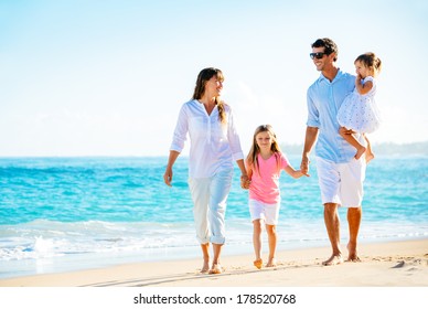 Family Having Fun On The Beach