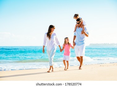 Family Having Fun On The Beach