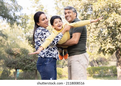 Family Having Fun At Park