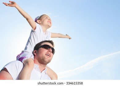 a family having good time in front of a sea - Powered by Shutterstock