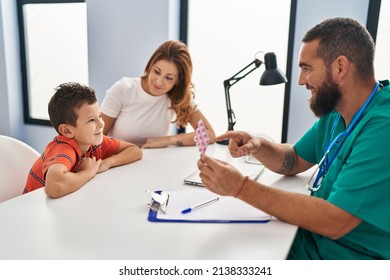 Family Having Medical Consultation Prescribe Pills At Clinic