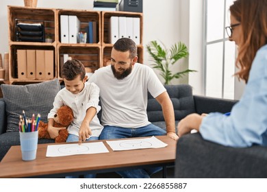 Family having psychology session choosing emotion emoji draw at psychology center - Powered by Shutterstock