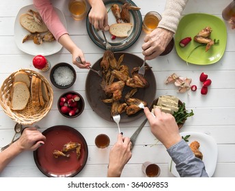 family having roasted chicken wings for dinner top view - Shutterstock ID 364069853