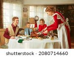 Family having a thanksgiving dinner together, 50s retro style 