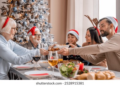 Family helping serve Christmas dinner at home. Toasting and cheers with flutes glasses while celebrating New Year dining at festive table. - Powered by Shutterstock