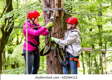 Family  In High Rope Course Or Park Climbing