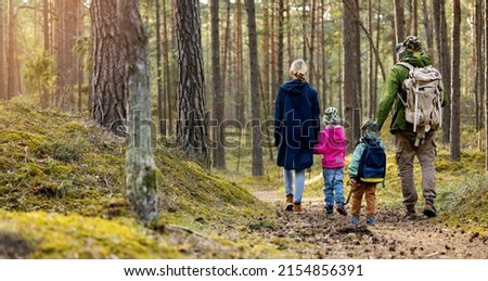 family hike in the forest with children. copy space
