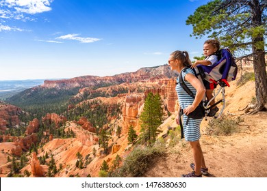 Family Hiking In Bryce Canyon National Park, Utah, USA Looking Out At A Scenic View