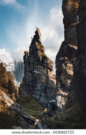 Family hiking father and child in rocky mountains travel active summer vacations parent and kid adventure trip outdoor enjoying rock formations views in Norway 