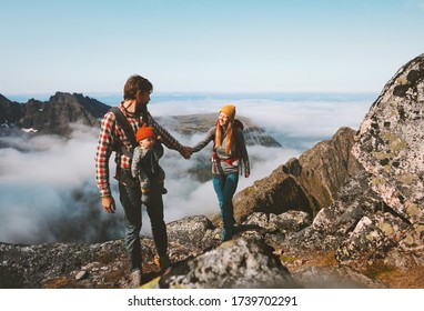 Family Hiking Man And Woman Traveling With Baby Carrier Outdoor Healthy Lifestyle Vacations In Mountains Mother And Father Holding Hands Eco Tourism Summer Activity 