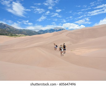 Family Hiking In The Mountains On Vacation Trip. Great Sand Dunes National Park ,Colorado, USA.