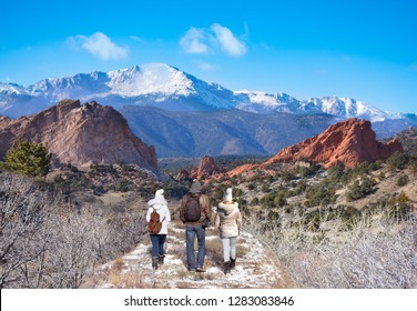 Family Hiking In The Mountains. People On Winter Break Enjoying Time Together.   Garden Of The Gods, Colorado Springs, Colorado,  USA.