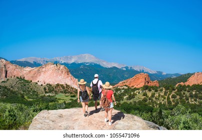 Family Hiking On Vacation  Trip In Colorado. Beautiful Red Mountains And Green Hills In Colorado. Garden Of The Gods, Colorado Springs, Colorado,  USA.