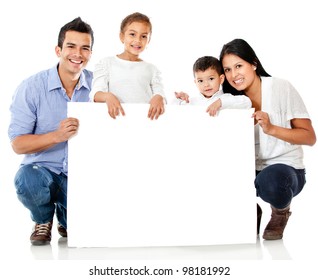 Family Holding A Banner And Smiling - Isolated Over A White Background